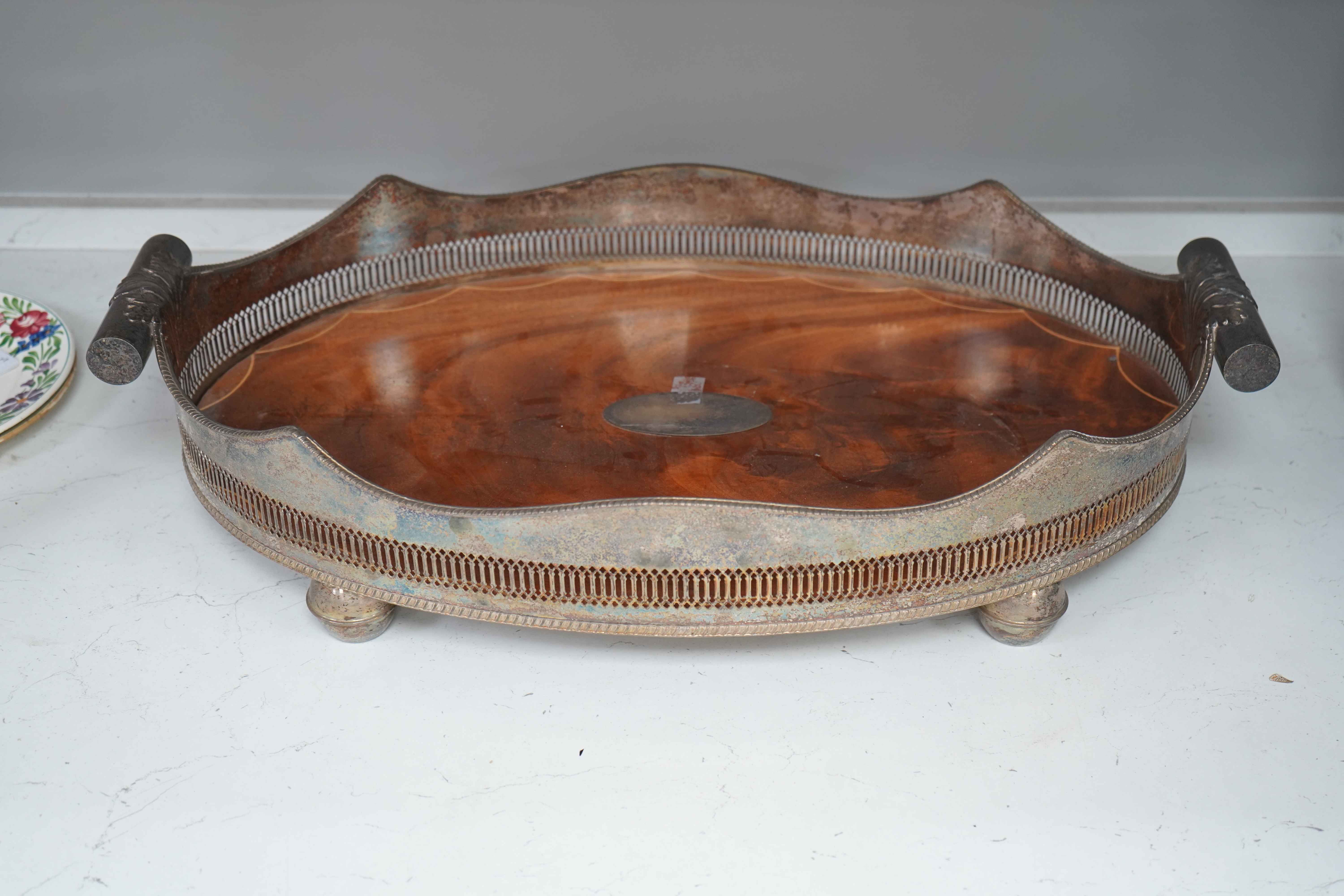 An early 20th century electroplate galleried mahogany tray, 66cm wide. Condition - fair